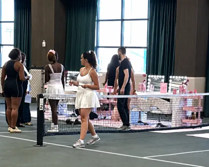 A branded activation set up alongside the court