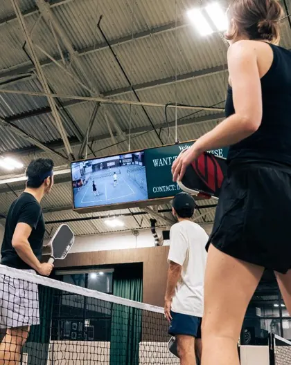 Live match scoring on the overhead screens