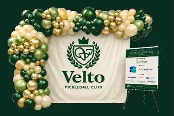 Balloon garland and branded step-and-repeat backdrop