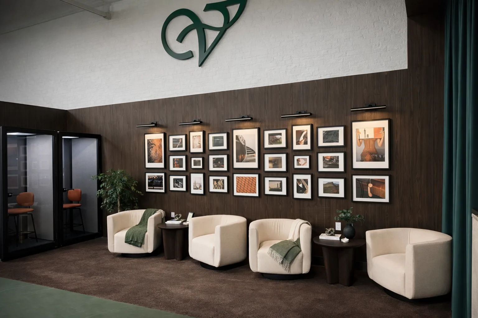 Seating area with gallery wall and phone booths